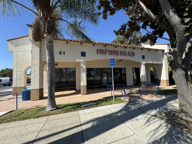 a view of a building with sitting area
