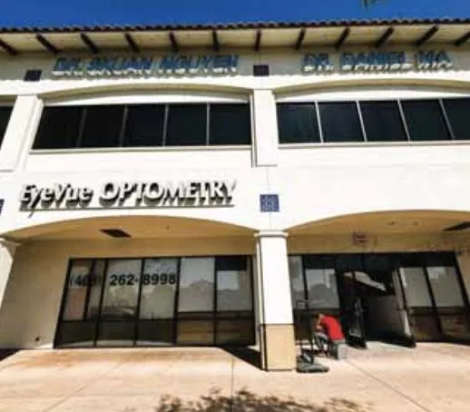 a couple of cars parked in front of a building