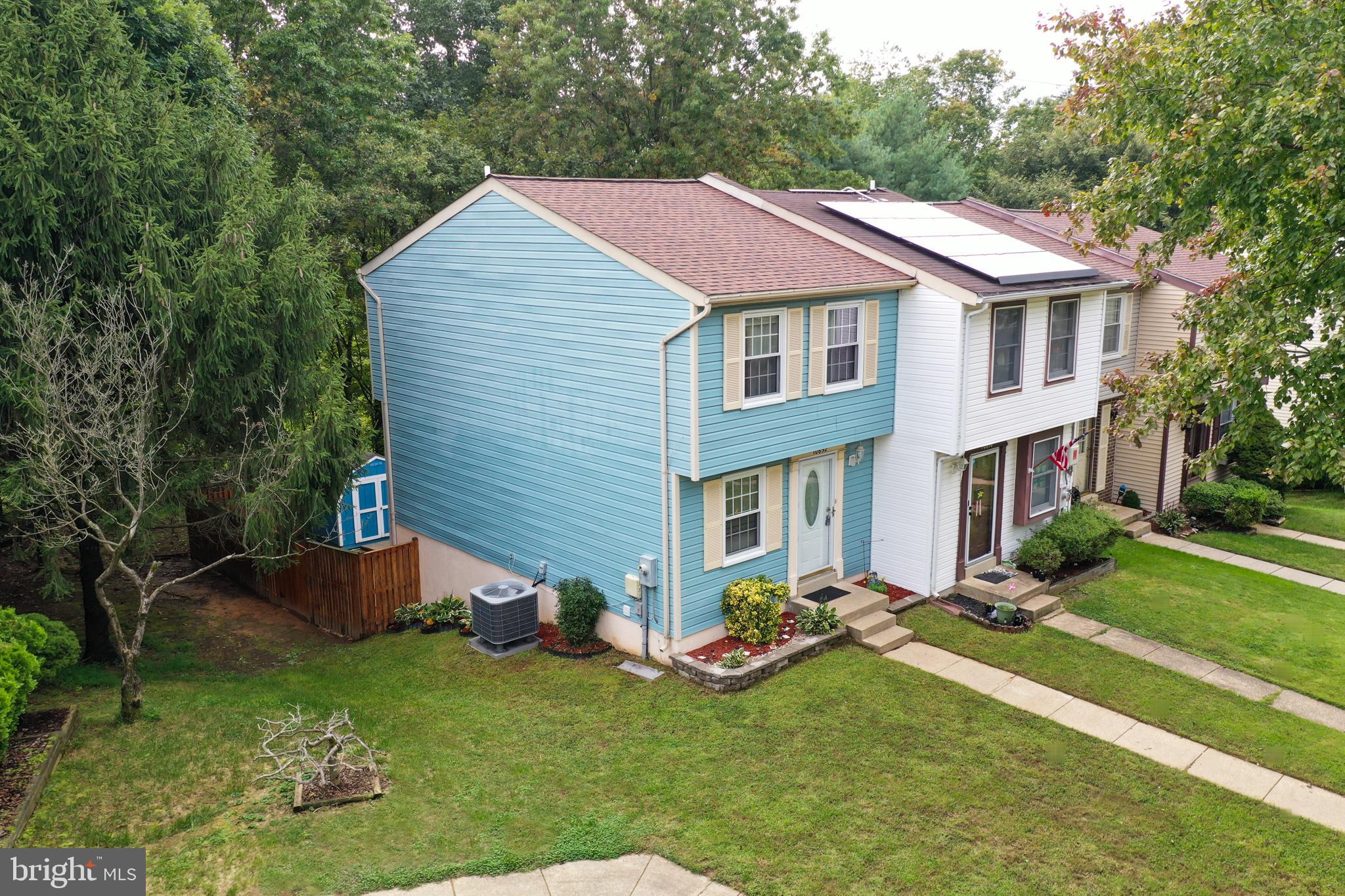 a aerial view of a house with yard and sitting area