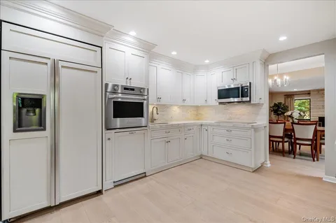 a large kitchen with cabinets