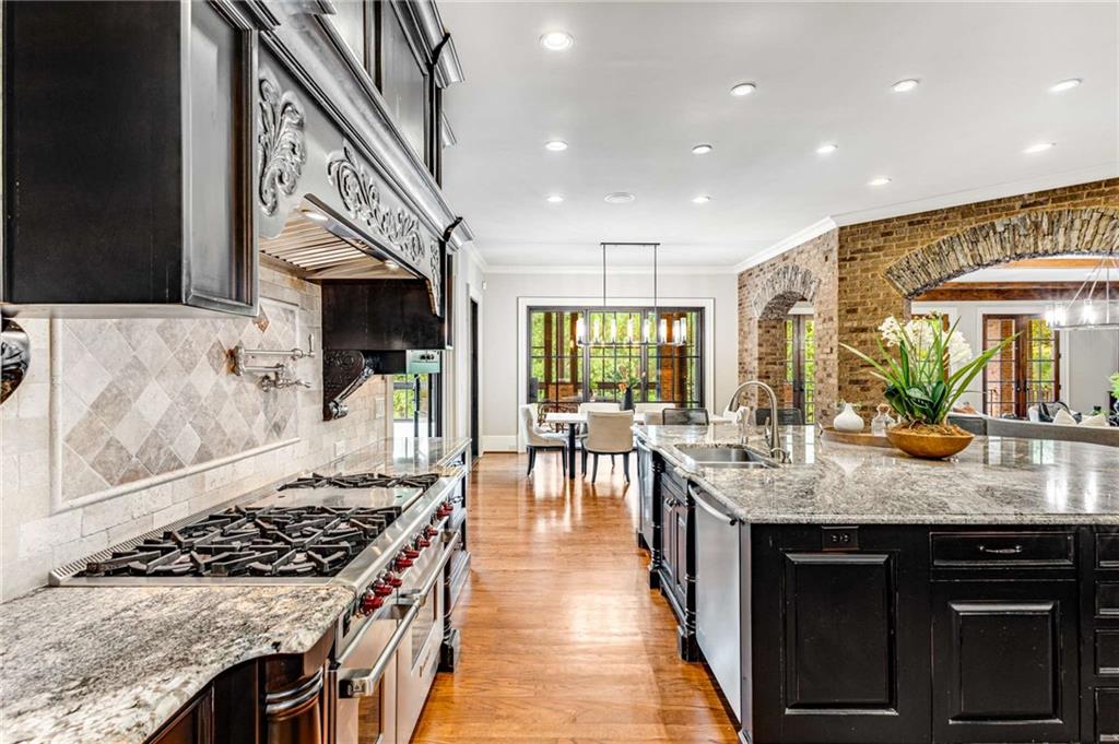 56 Mt Paran Road Northwest Atlanta, GA 30327 - Photo 13 of 52 a kitchen with lots of counter top space a sink appliances and cabinets