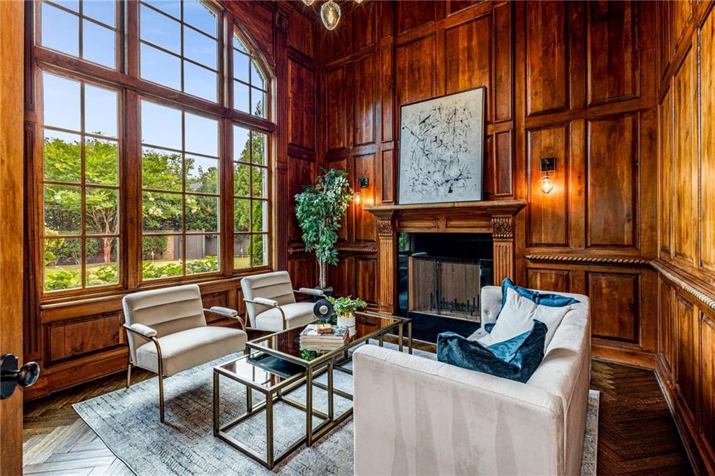56 Mt Paran Road Northwest Atlanta, GA 30327 - Photo 15 of 52 a living room with furniture a fireplace and a large window