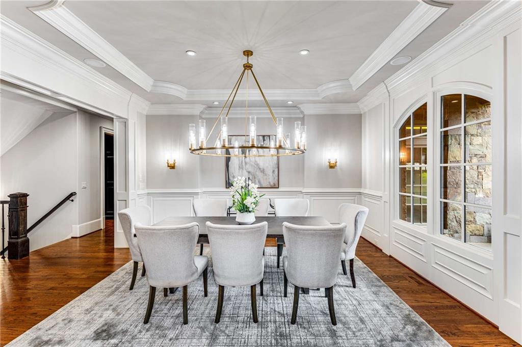 56 Mt Paran Road Northwest Atlanta, GA 30327 - Photo 16 of 52 a dining room with furniture a chandelier and wooden floor