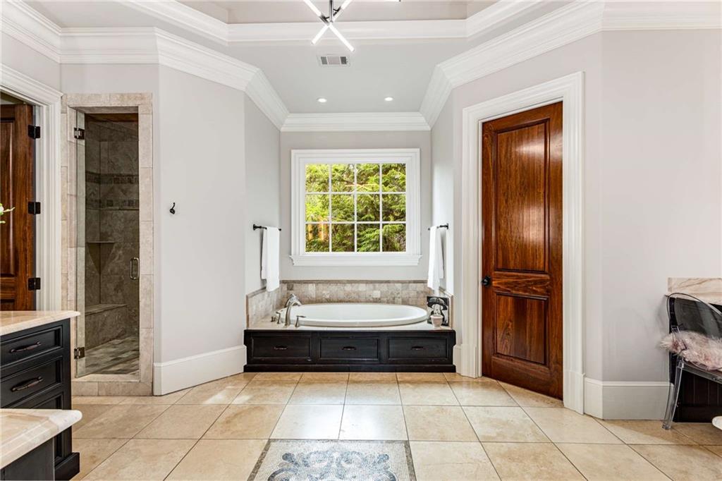 56 Mt Paran Road Northwest Atlanta, GA 30327 - Photo 20 of 52 a spacious bathroom with a tub and a shower
