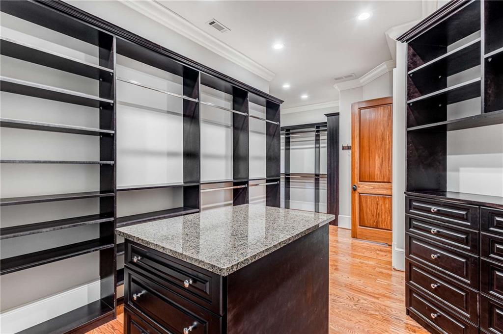 56 Mt Paran Road Northwest Atlanta, GA 30327 - Photo 22 of 52 a kitchen with stainless steel appliances granite countertop a refrigerator and a stove top oven