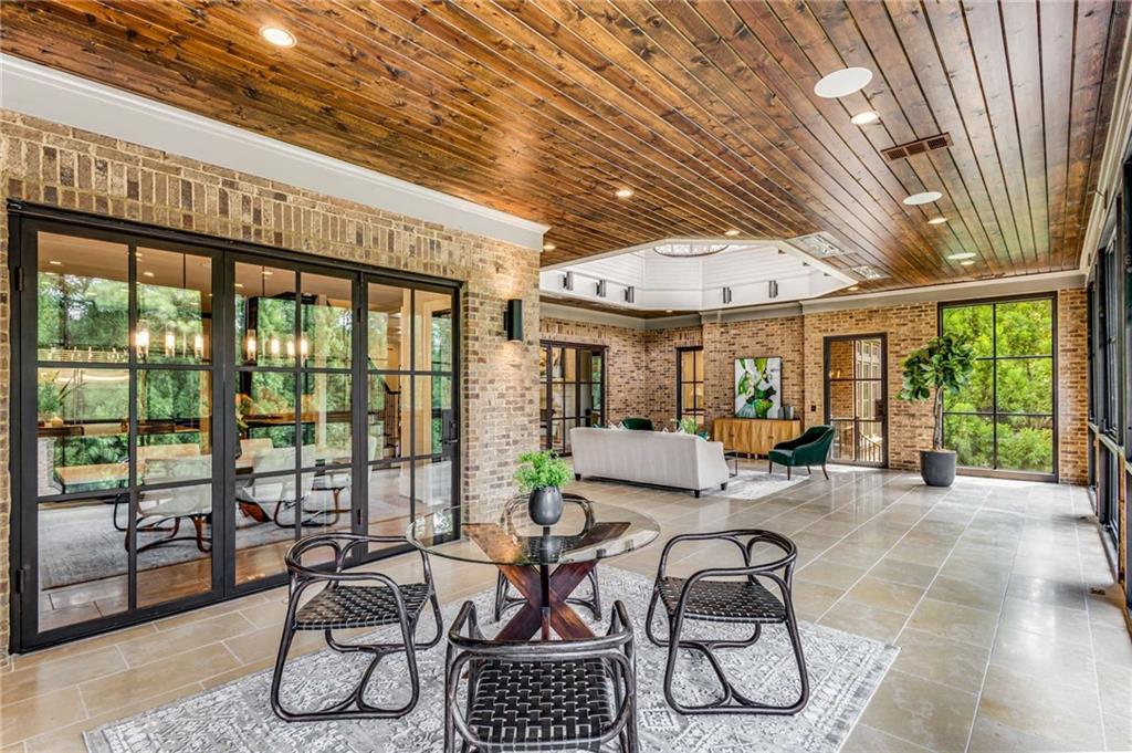 56 Mt Paran Road Northwest Atlanta, GA 30327 - Photo 26 of 52 a building outdoor space with patio furniture and potted plants