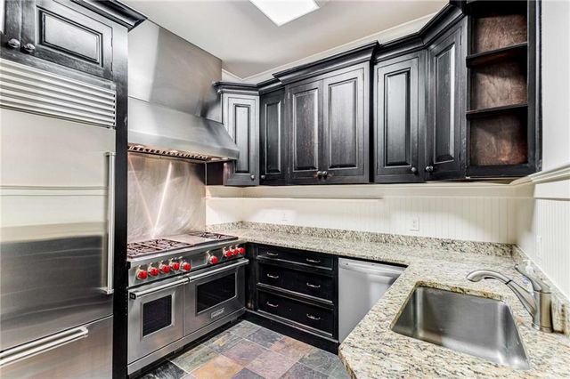 a utility room with a sink a washer and dryer