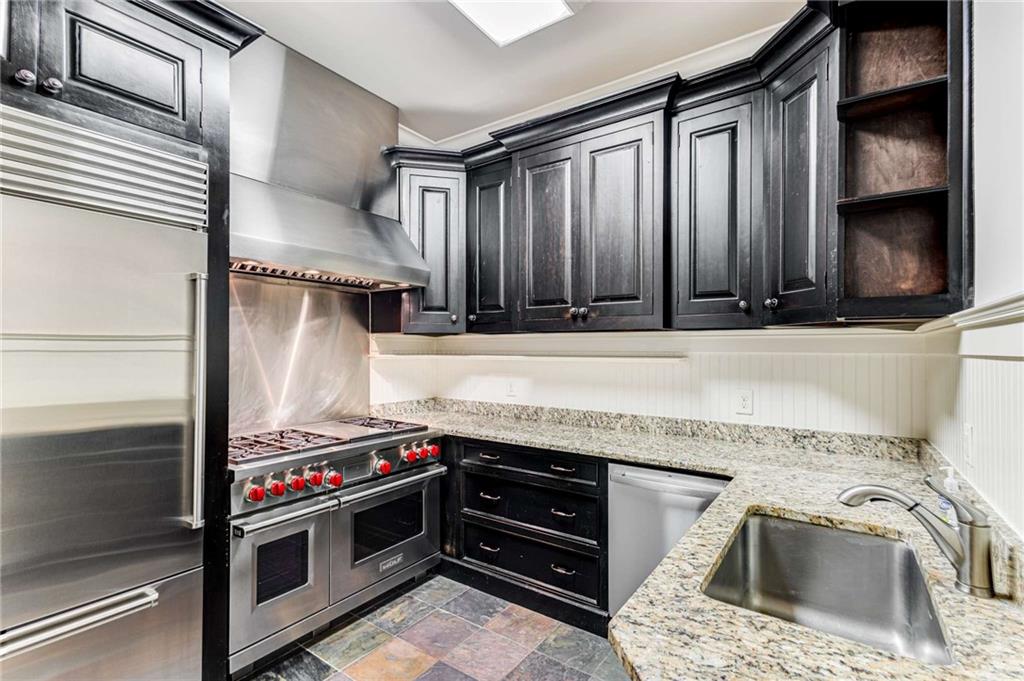 56 Mt Paran Road Northwest Atlanta, GA 30327 - Photo 31 of 52 a kitchen with granite countertop a stove and a sink