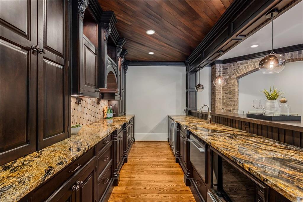 56 Mt Paran Road Northwest Atlanta, GA 30327 - Photo 41 of 52 a large kitchen with granite countertop a sink and a wooden floor