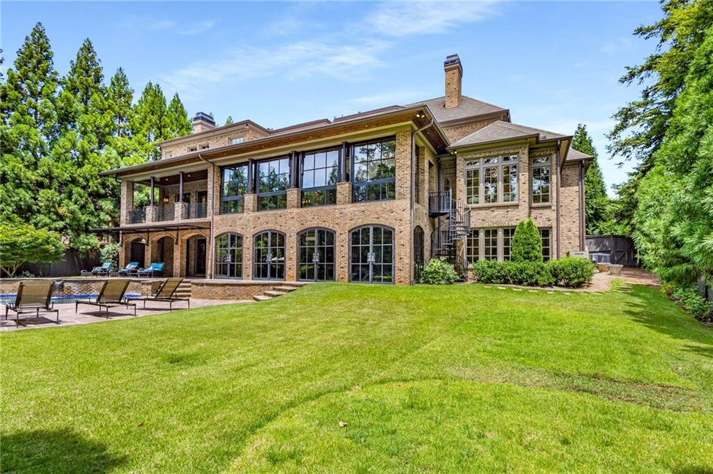 56 Mt Paran Road Northwest Atlanta, GA 30327 - Photo 50 of 52 a front view of a house with a garden