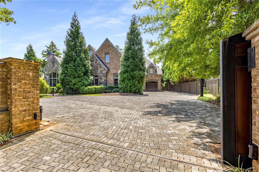 56 Mt Paran Road Northwest Atlanta, GA 30327 - Photo 6 of 52 a view of a backyard with large trees and plants