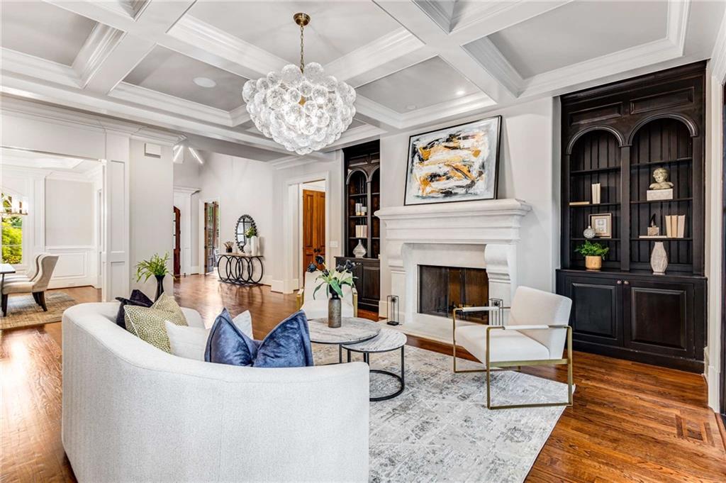 56 Mt Paran Road Northwest Atlanta, GA 30327 - Photo 9 of 52 a living room with furniture a chandelier and a fireplace
