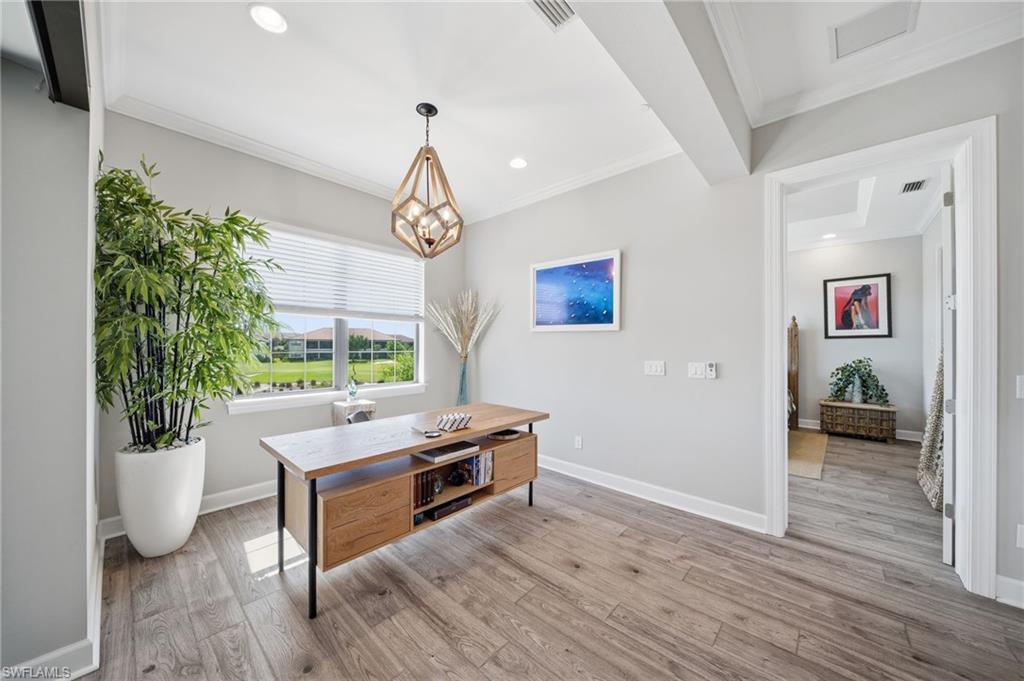 9658 Montelanico Loop, Unit 201 Naples, FL 34119 - Photo 12 of 46 a view of a livingroom with furniture wooden floor and window