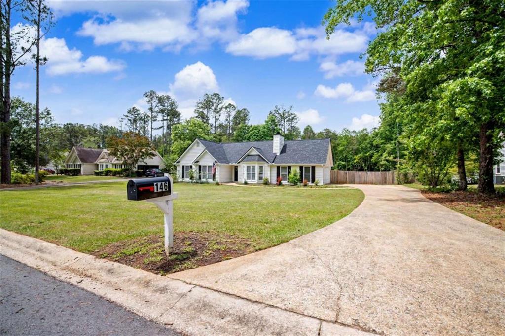 146 Jeb Stuart Drive Newnan, GA 30265 - Photo 1 of 33 a front view of a house with garden
