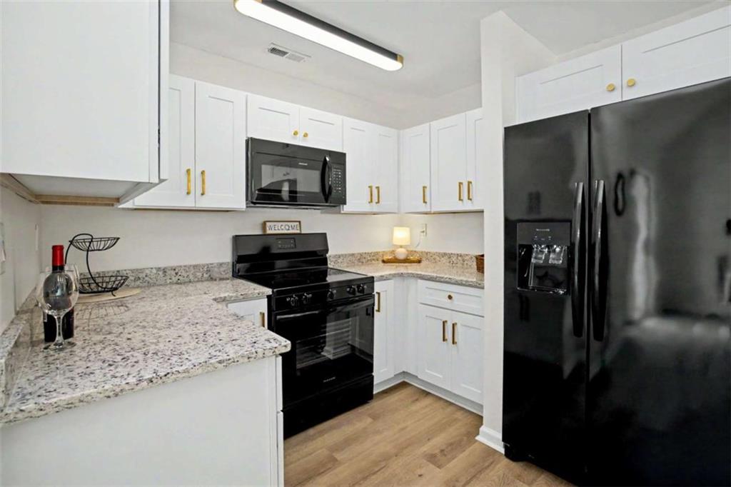 146 Jeb Stuart Drive Newnan, GA 30265 - Photo 15 of 33 a kitchen with a refrigerator stove and sink