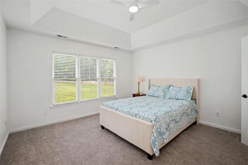 146 Jeb Stuart Drive Newnan, GA 30265 - Photo 18 of 33 a bed sitting in a bedroom next to a window