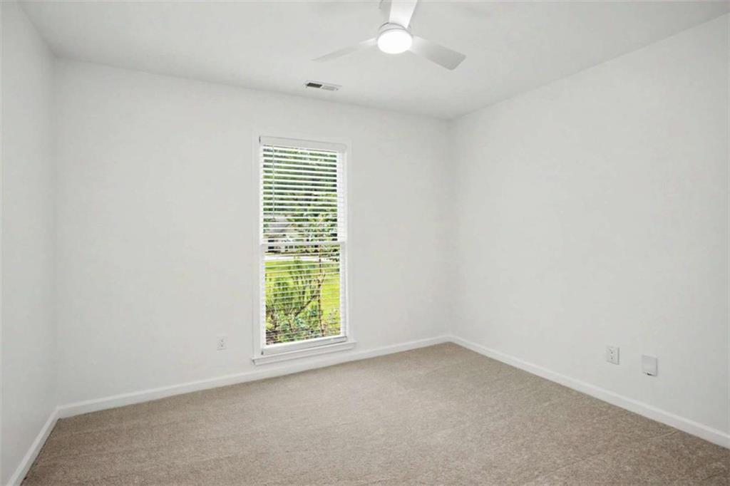 146 Jeb Stuart Drive Newnan, GA 30265 - Photo 24 of 33 an empty room with windows
