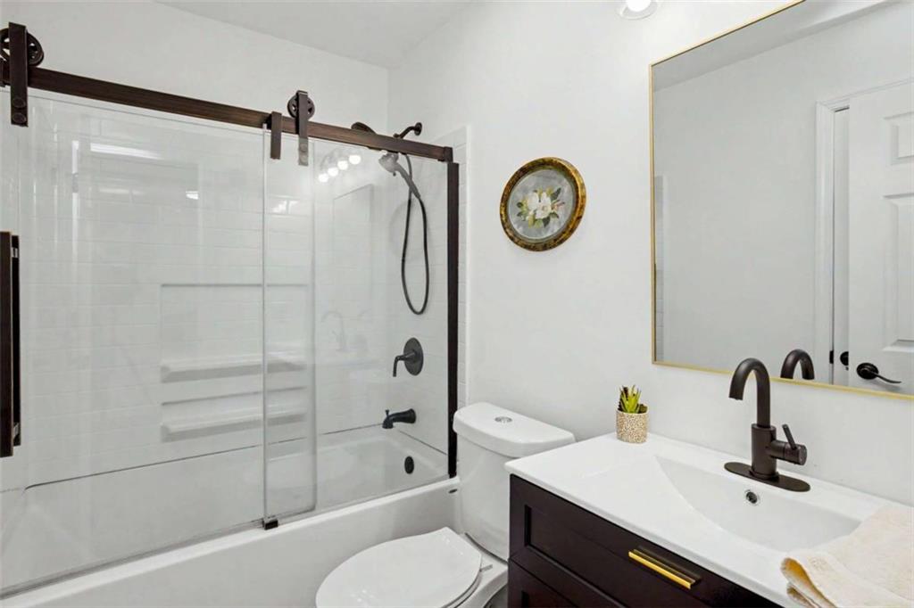 146 Jeb Stuart Drive Newnan, GA 30265 - Photo 26 of 33 a bathroom with a sink a toilet and a shower