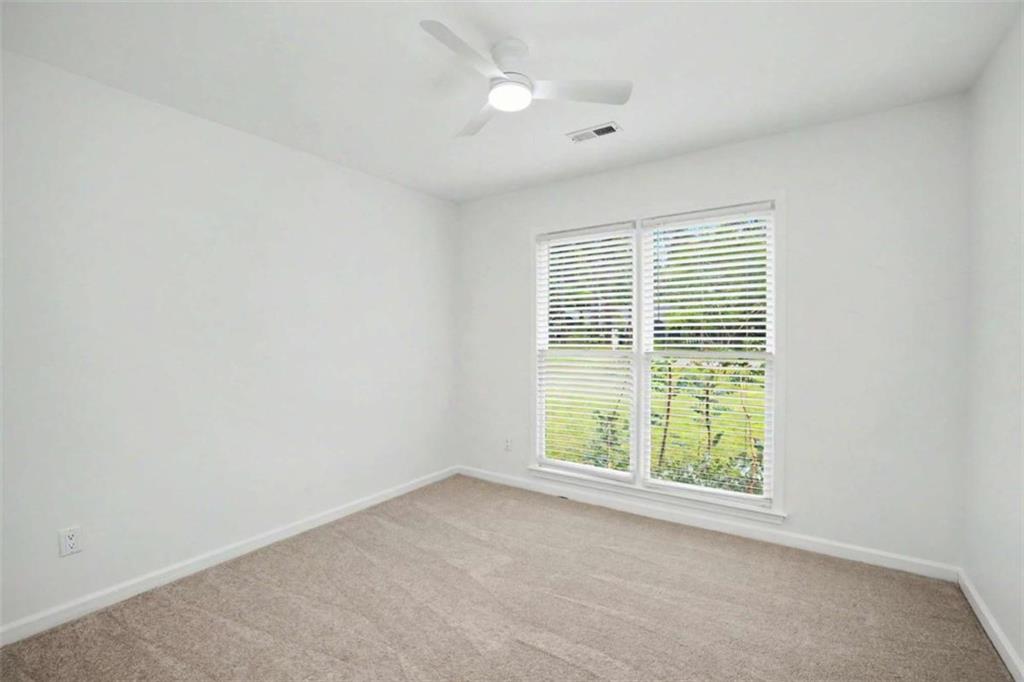 146 Jeb Stuart Drive Newnan, GA 30265 - Photo 27 of 33 an empty room with windows