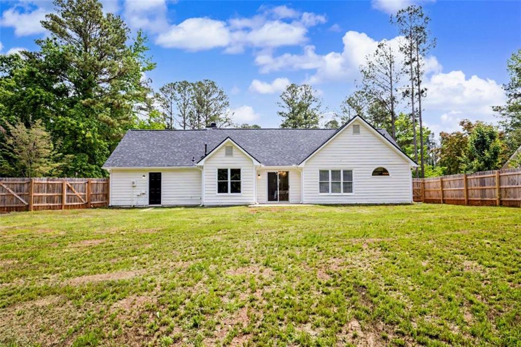 146 Jeb Stuart Drive Newnan, GA 30265 - Photo 30 of 33 a view of a yard in front of a house with large trees