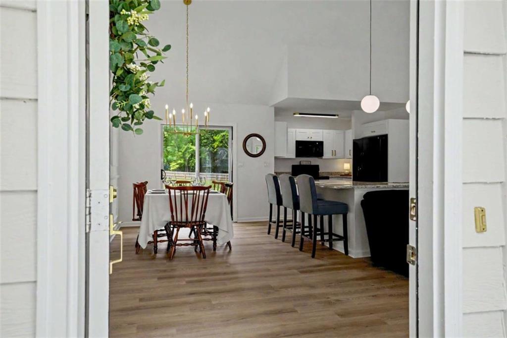 146 Jeb Stuart Drive Newnan, GA 30265 - Photo 3 of 33 a view of a dining room with furniture and wooden floor