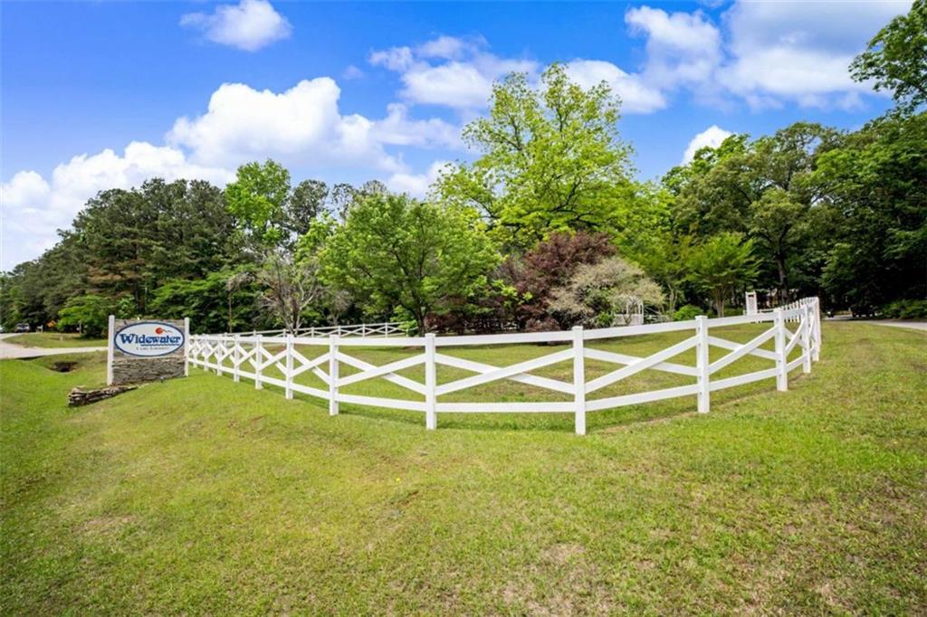 146 Jeb Stuart Drive Newnan, GA 30265 - Photo 32 of 33 a view of a white building with swimming pool in front of it