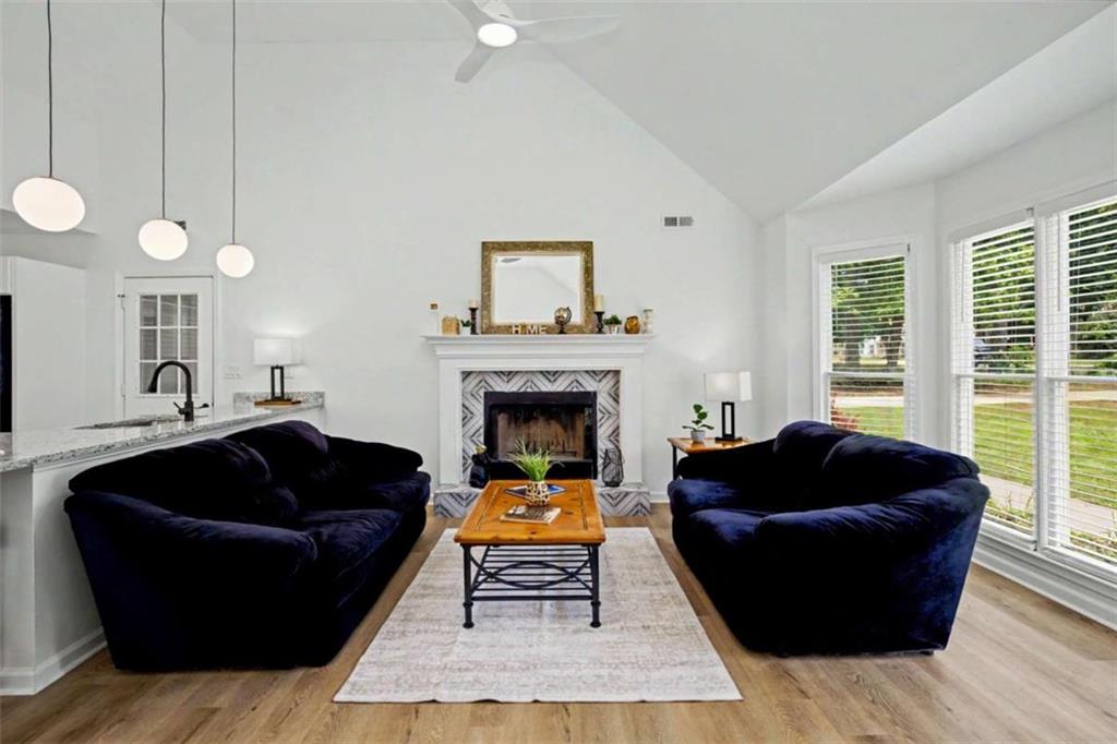 146 Jeb Stuart Drive Newnan, GA 30265 - Photo 6 of 33 a living room with furniture and a fireplace