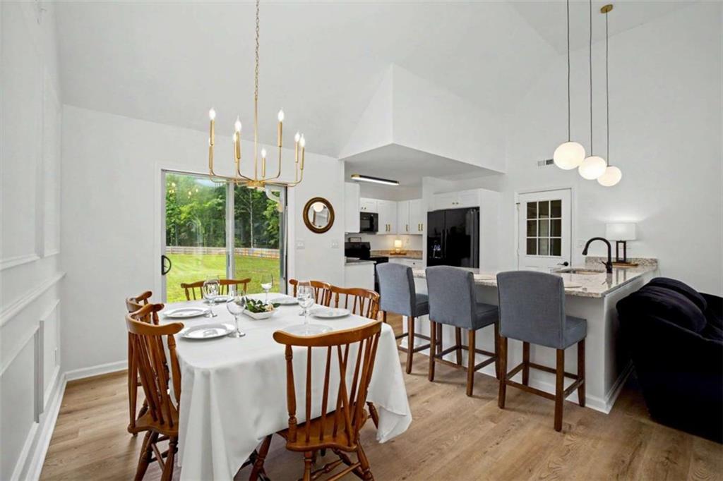 146 Jeb Stuart Drive Newnan, GA 30265 - Photo 10 of 33 a view of a dining room with furniture window and wooden floor