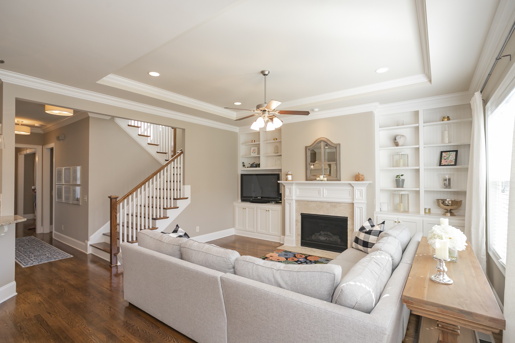 431 Avon River Road Franklin, TN 37064 - Photo 4 of 33 a living room with furniture a fireplace and a chandelier