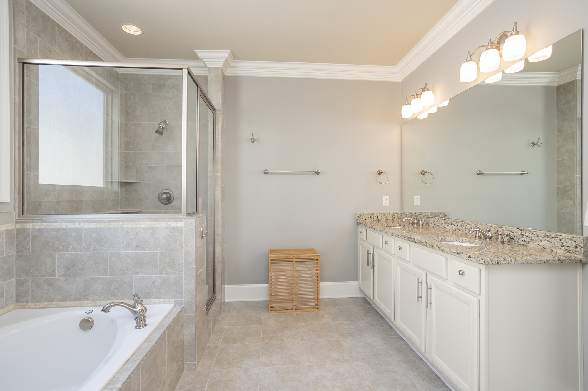431 Avon River Road Franklin, TN 37064 - Photo 9 of 33 a bathroom with a granite countertop sink a large mirror and a bathtub