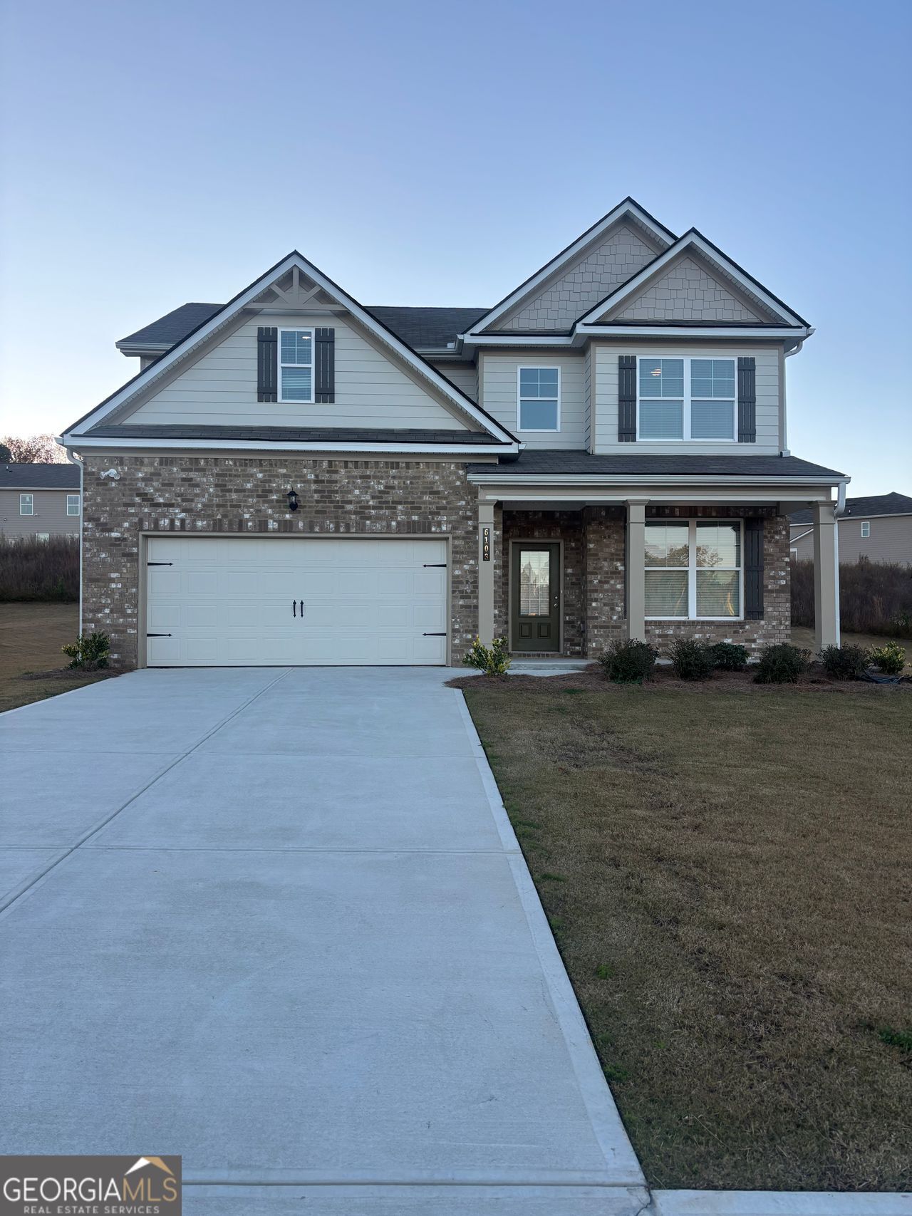 6061 Spring Way Stonecrest, GA 30038 - Photo 2 of 2 a front view of a house with a yard