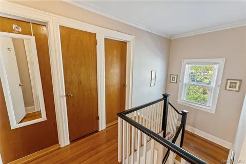 a view of a balcony with wooden floor and stairs