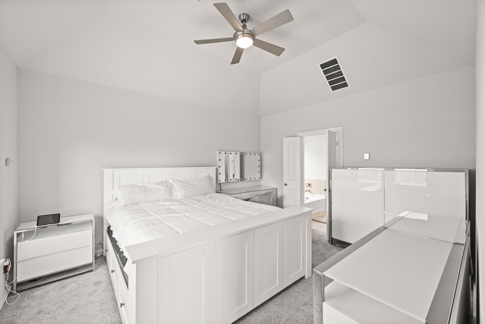 5010 Chestnut Orchard Drive Houston, TX 77066 - Photo 12 of 31 a room with a bed and a chandelier