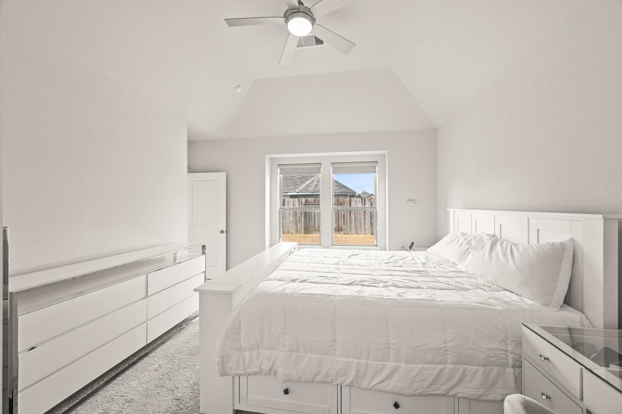 5010 Chestnut Orchard Drive Houston, TX 77066 - Photo 13 of 31 a bedroom with a bed and a large window