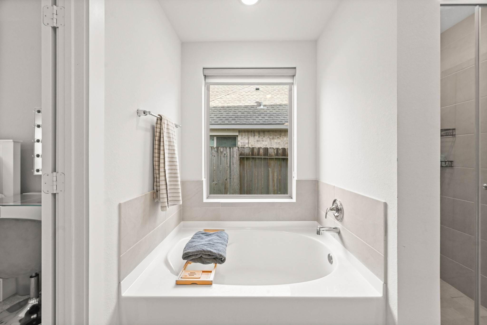 5010 Chestnut Orchard Drive Houston, TX 77066 - Photo 15 of 31 a bath tub sitting next to a window