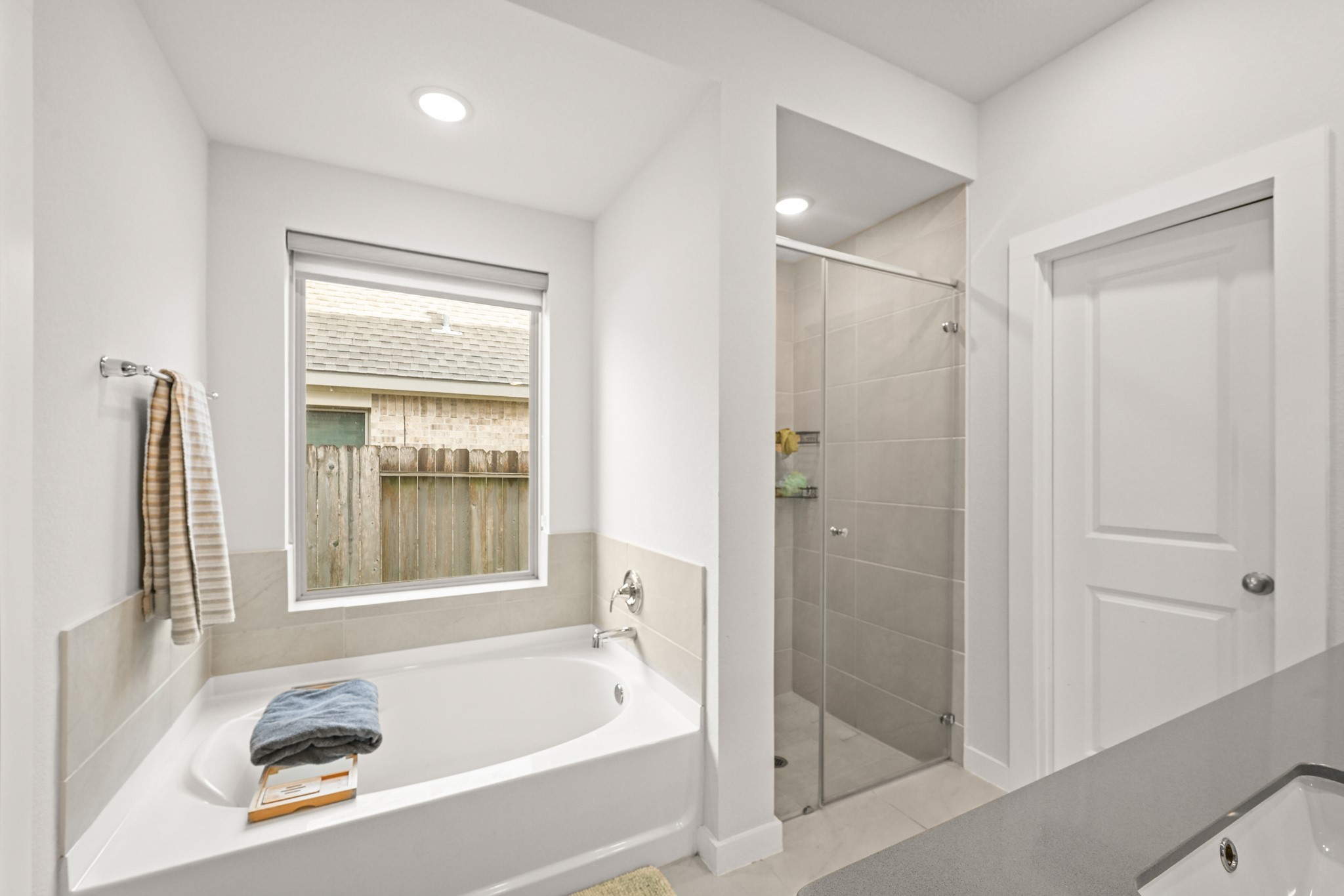 5010 Chestnut Orchard Drive Houston, TX 77066 - Photo 16 of 31 a bathroom with a tub and a shower