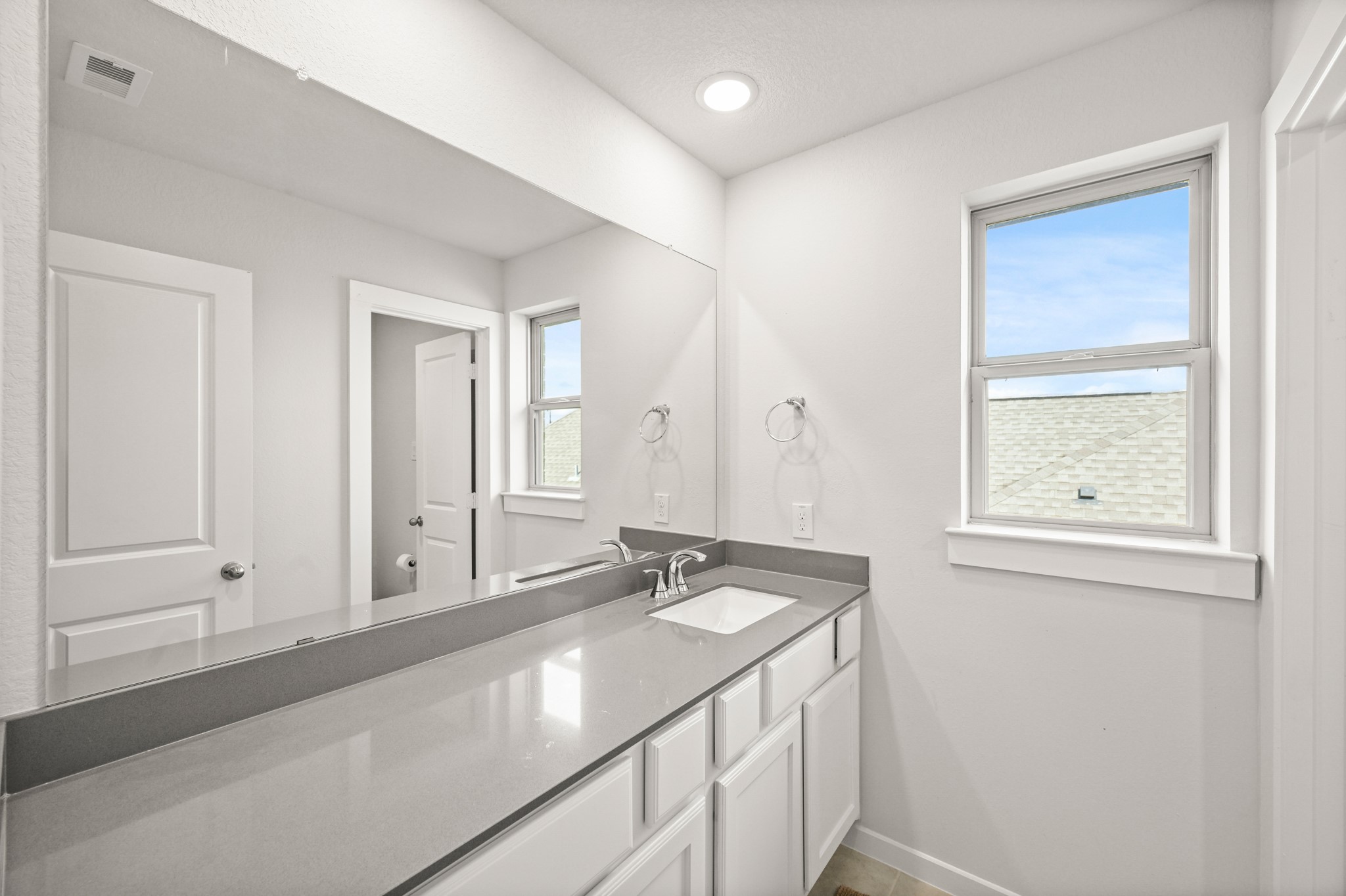 5010 Chestnut Orchard Drive Houston, TX 77066 - Photo 27 of 31 a bathroom with a sink and a mirror