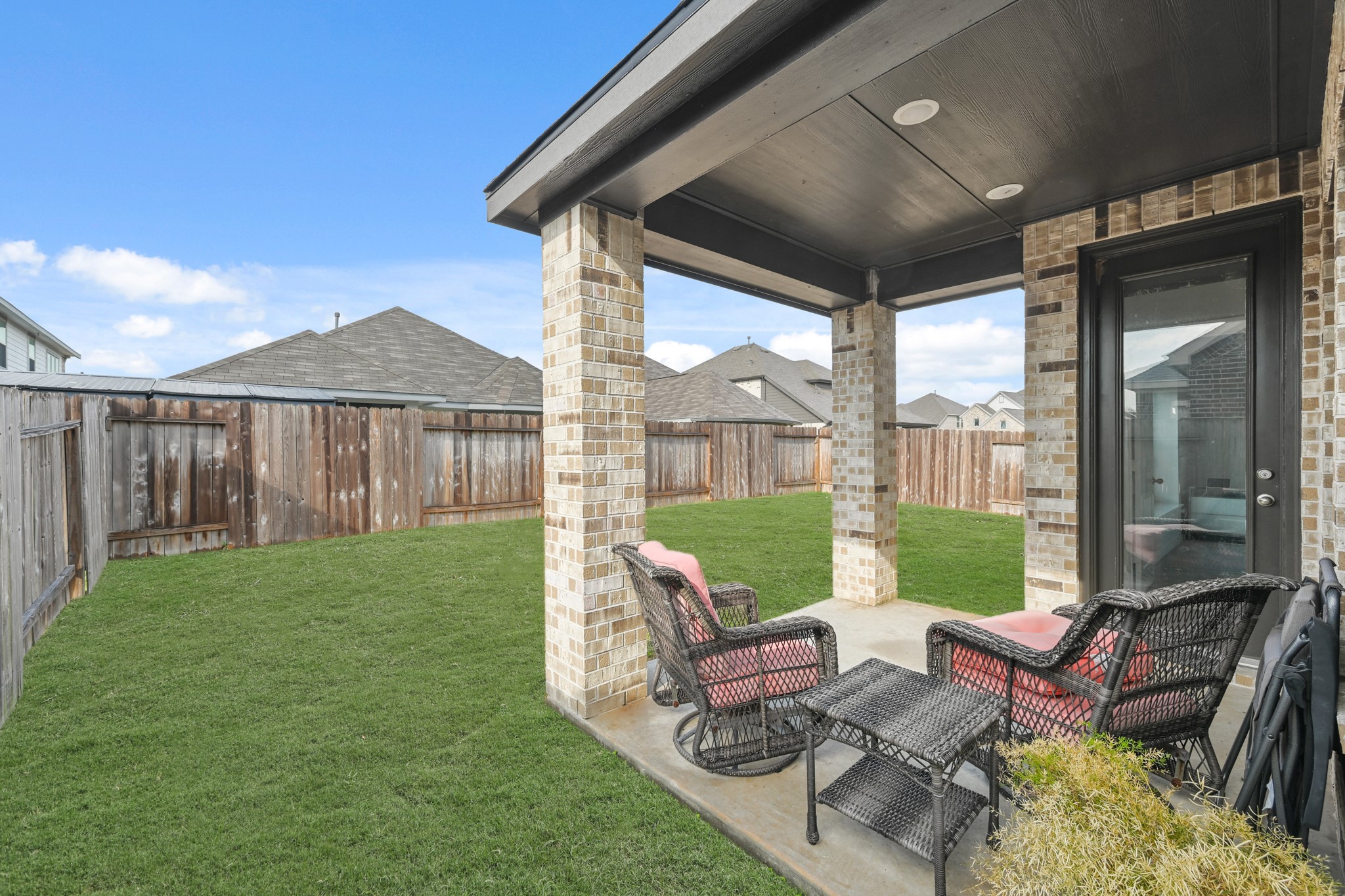 5010 Chestnut Orchard Drive Houston, TX 77066 - Photo 31 of 31 a view of a patio with couches chairs and a yard