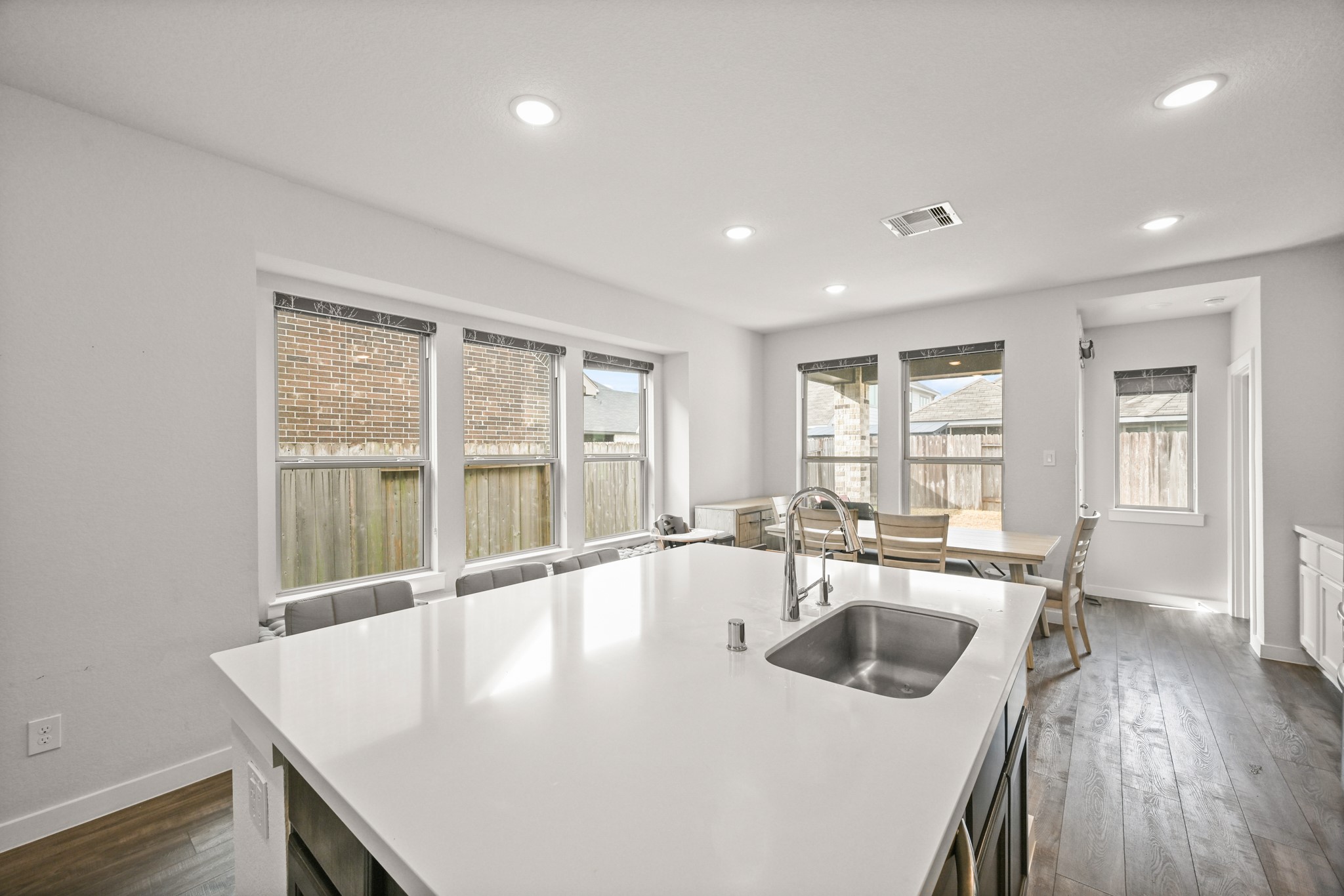 5010 Chestnut Orchard Drive Houston, TX 77066 - Photo 8 of 31 a kitchen with a sink a counter space and living room