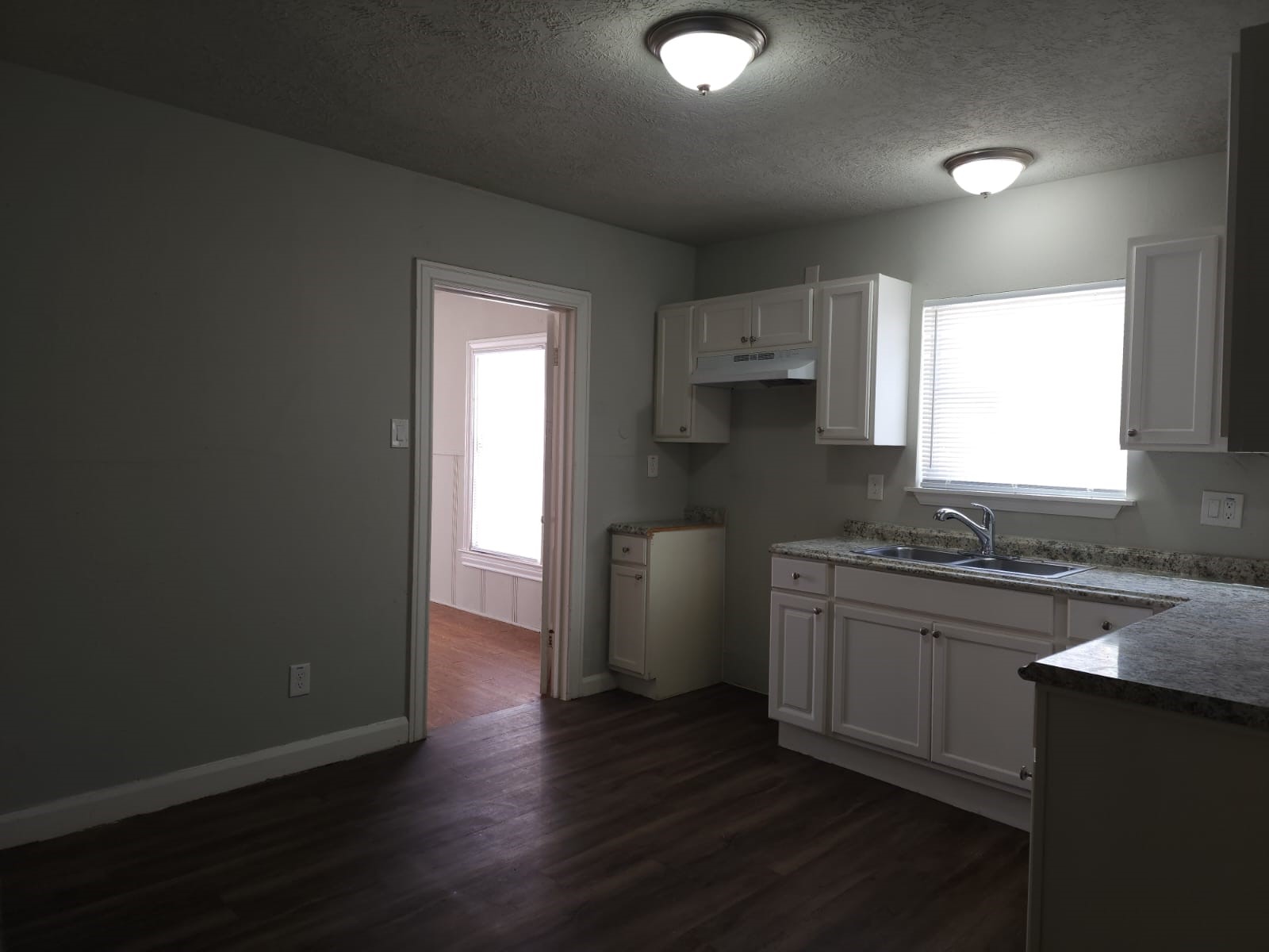 1350 Edwin Street Beaumont, TX 77705 - Photo 6 of 23 a kitchen with a sink a stove a refrigerator and cabinets
