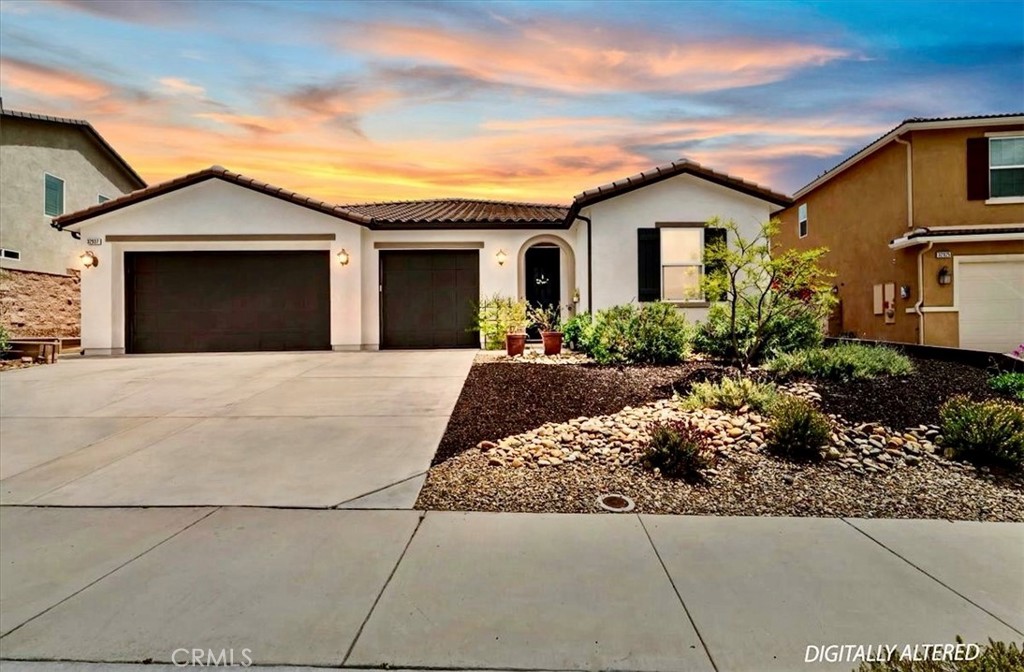 32937 Marin Fields Road Winchester, CA 92596 - Photo 1 of 47 a front view of a house with a yard and garage