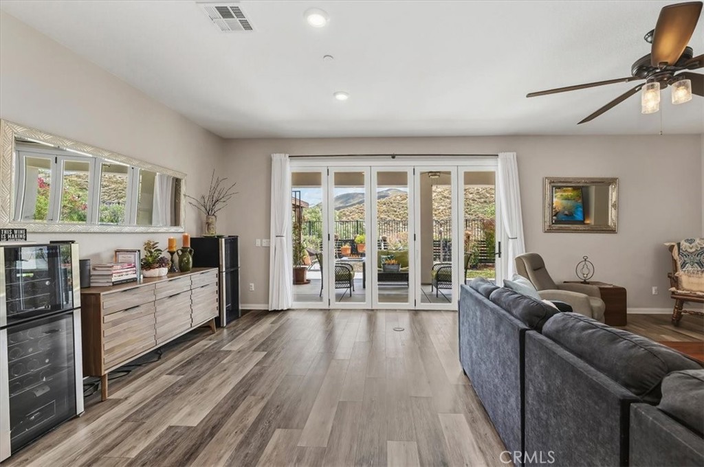 32937 Marin Fields Road Winchester, CA 92596 - Photo 13 of 47 a living room with furniture and large windows