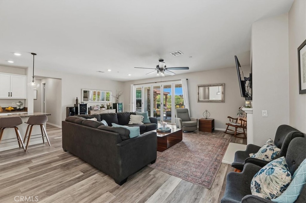 32937 Marin Fields Road Winchester, CA 92596 - Photo 16 of 47 a living room with furniture and wooden floor