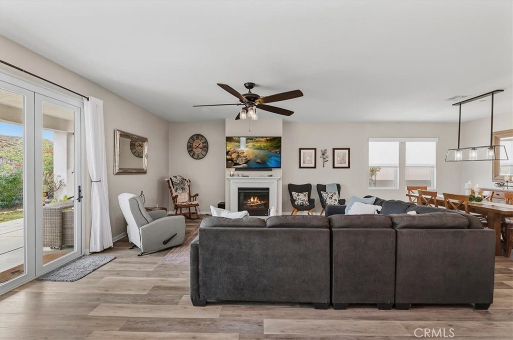 32937 Marin Fields Road Winchester, CA 92596 - Photo 17 of 47 a living room with fireplace furniture and a window