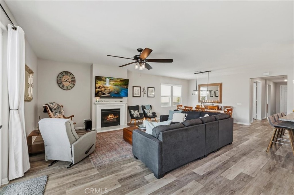 32937 Marin Fields Road Winchester, CA 92596 - Photo 18 of 47 a living room with furniture and a fireplace