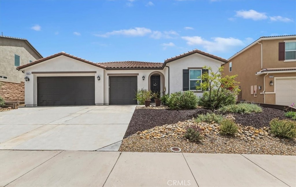 32937 Marin Fields Road Winchester, CA 92596 - Photo 2 of 47 a front view of a house with garden