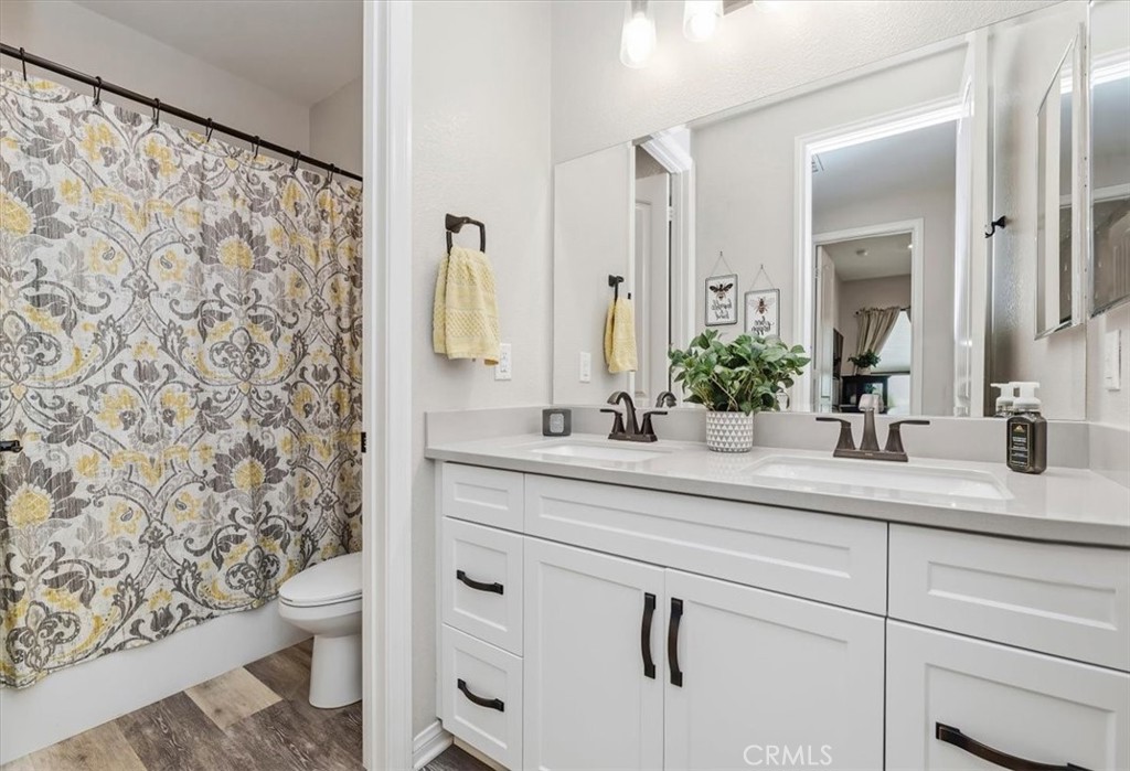 32937 Marin Fields Road Winchester, CA 92596 - Photo 24 of 47 a bathroom with a sink and a mirror