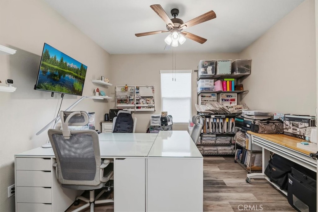 32937 Marin Fields Road Winchester, CA 92596 - Photo 29 of 47 a living room with furniture and a flat screen tv