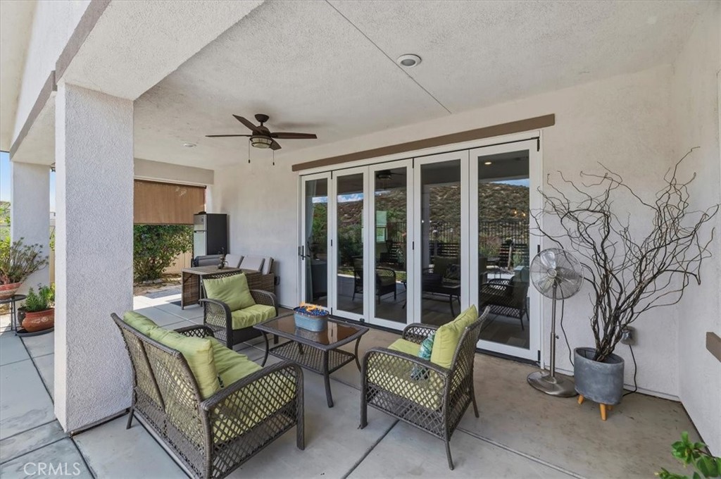 32937 Marin Fields Road Winchester, CA 92596 - Photo 38 of 47 a living room with furniture and a large window