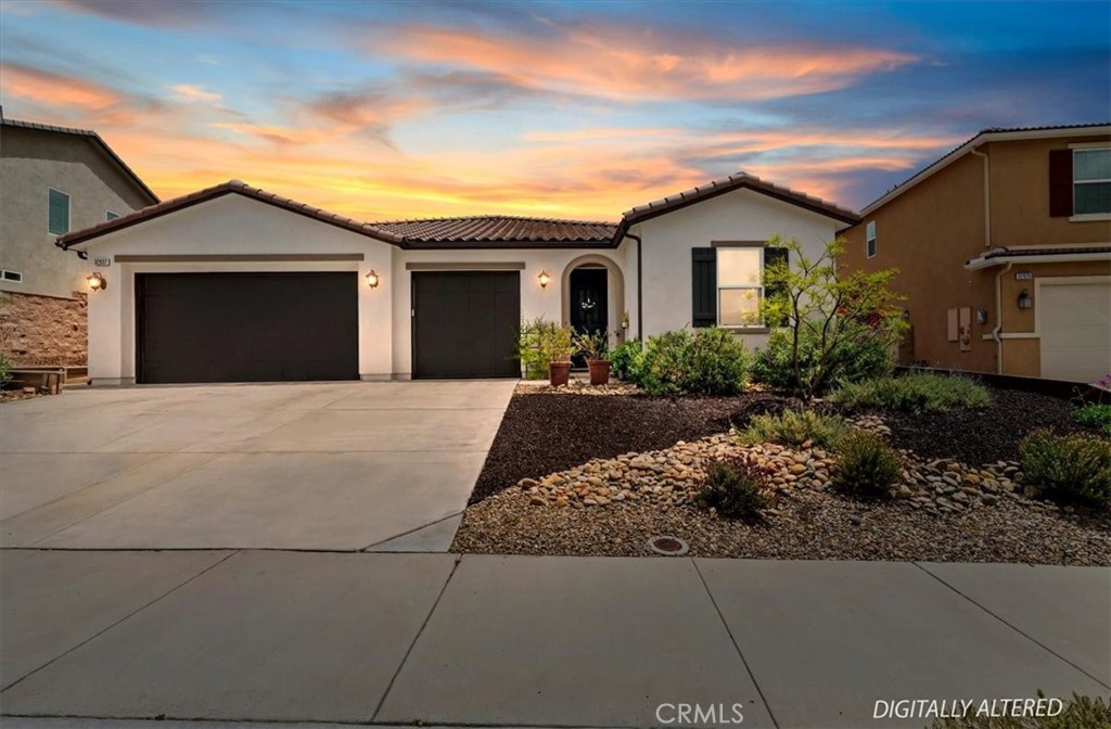 32937 Marin Fields Road Winchester, CA 92596 - Photo 47 of 47 a front view of a house with a yard and garage